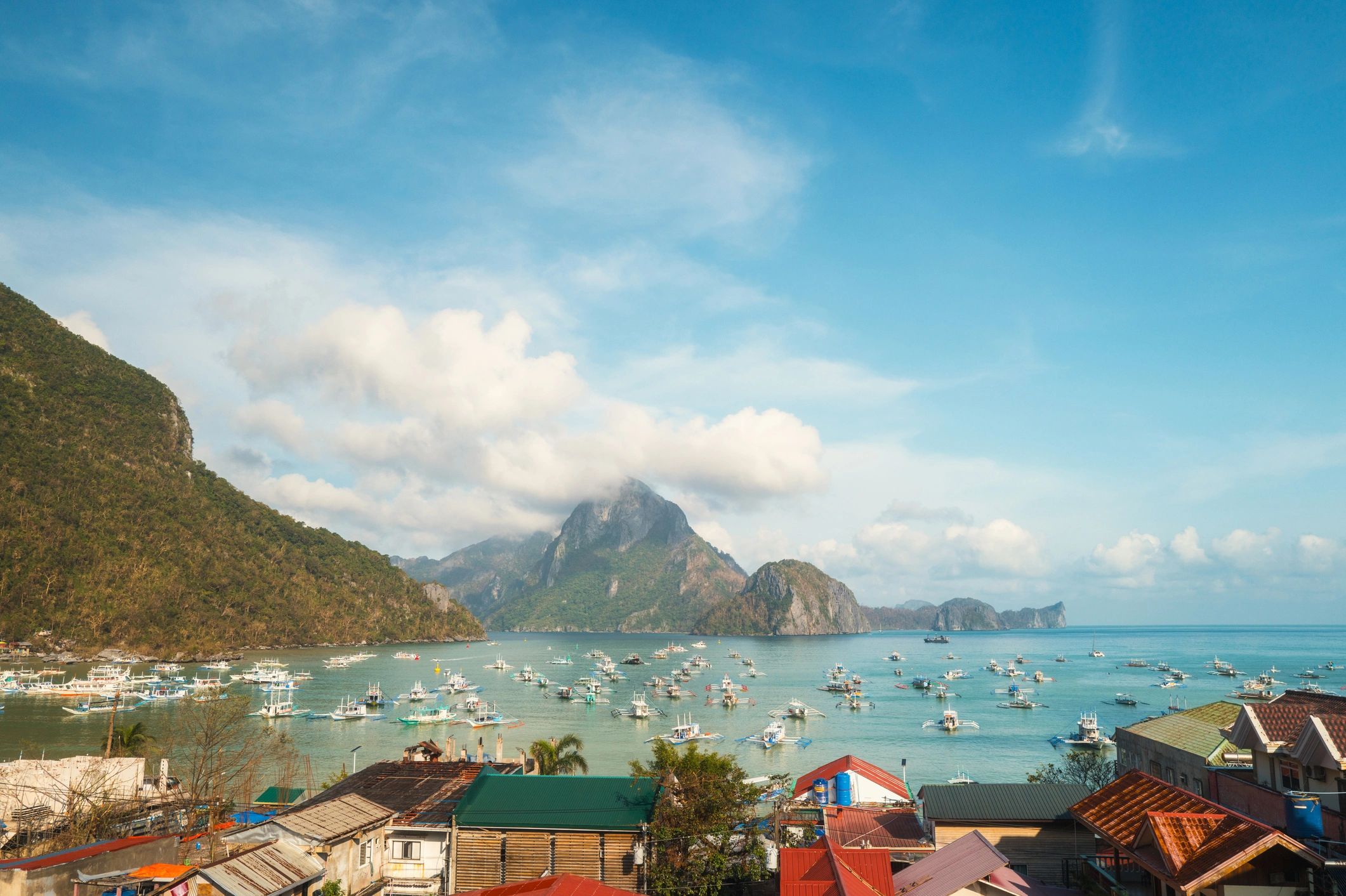 Coastal island landscape with blue water and dramatic shoreline