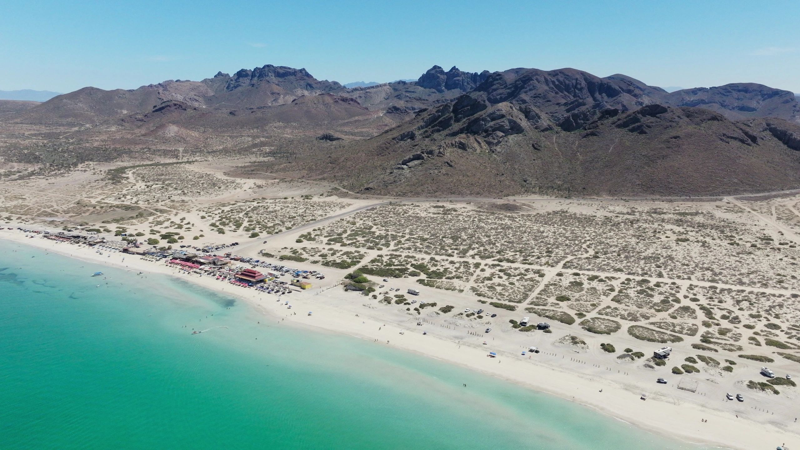 Beachfront with desert mountains and calm water in Baja California Sur
